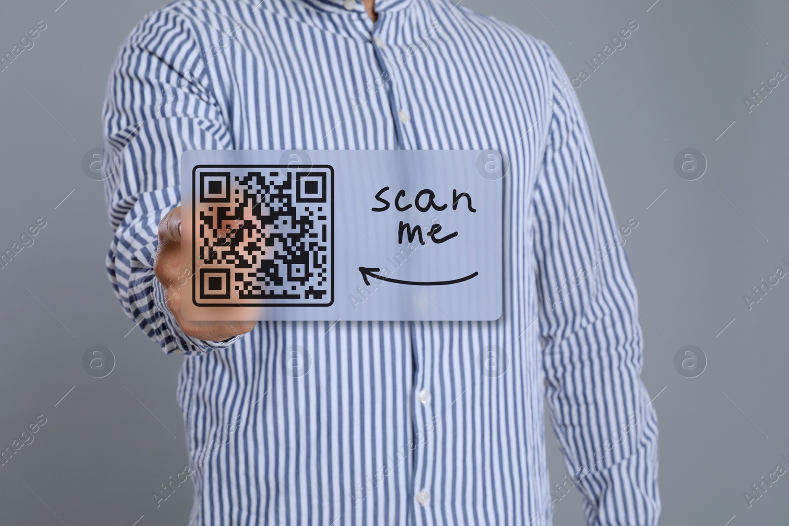 Image of Man pointing at illustration of QR code on light grey background, closeup