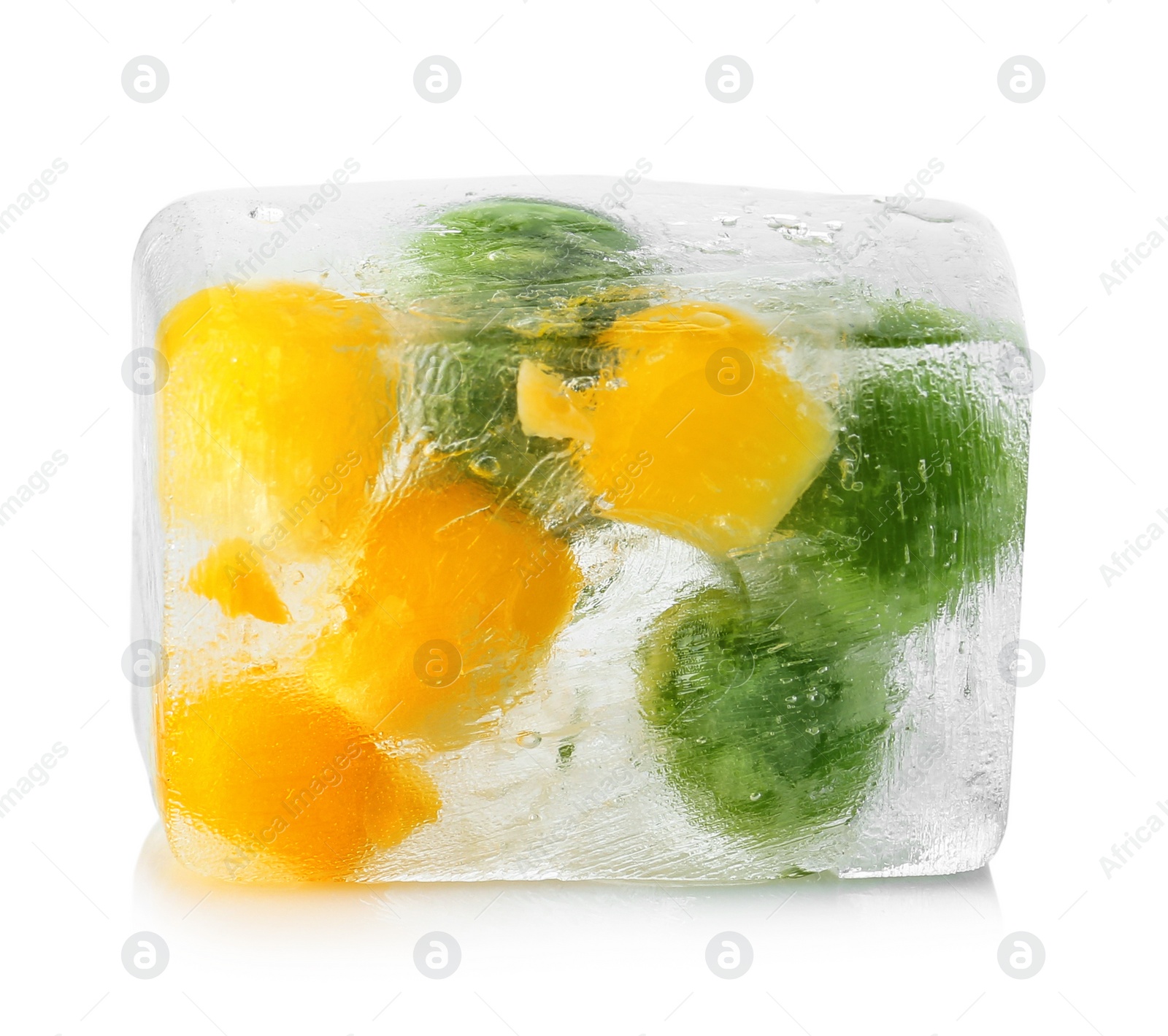 Photo of Corn grains and green peas in ice cube on white background. Frozen vegetables