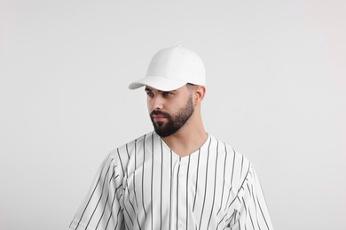 Photo of Man in stylish baseball cap on white background