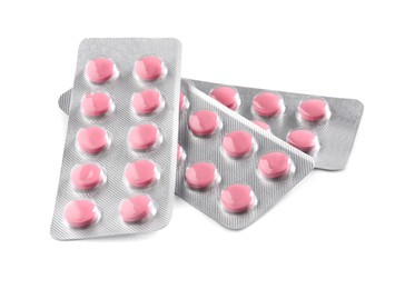 Photo of Blisters with pills on white background. Medicinal treatment
