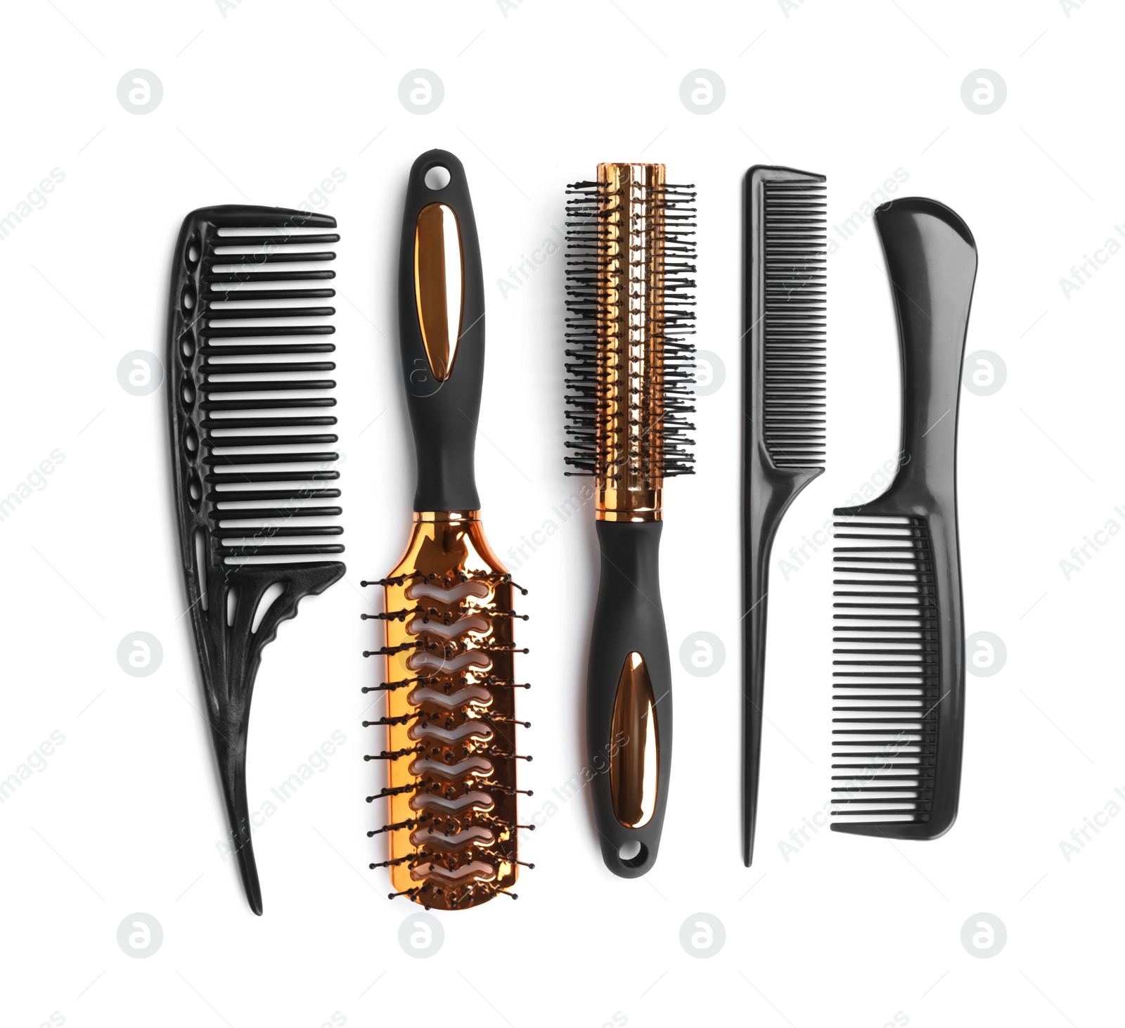 Photo of Set of modern hair combs and brushes isolated on white, top view