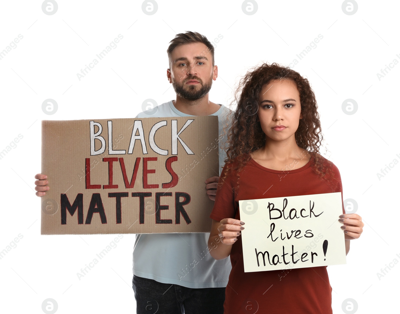 Photo of Young man and African American woman holding signs with phrase Black Lives Matter on white background. Racism concept