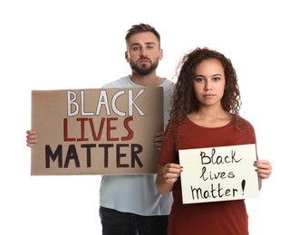 Young man and African American woman holding signs with phrase Black Lives Matter on white background. Racism concept