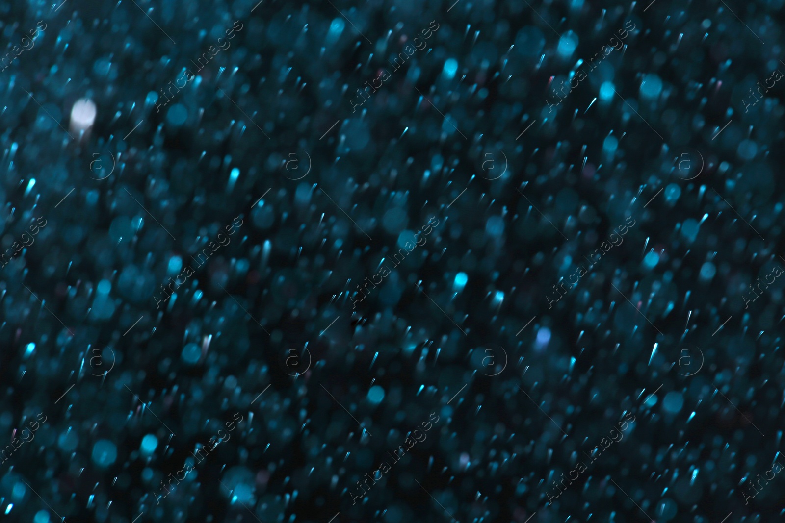 Photo of Magic blue bokeh effect on dark background