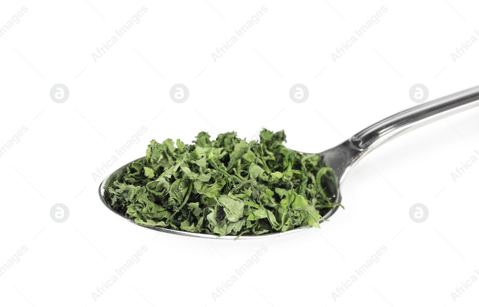 Photo of Spoon with dried parsley on white background