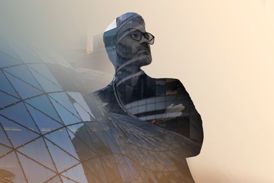 Double exposure of businessman and cityscape with office buildings