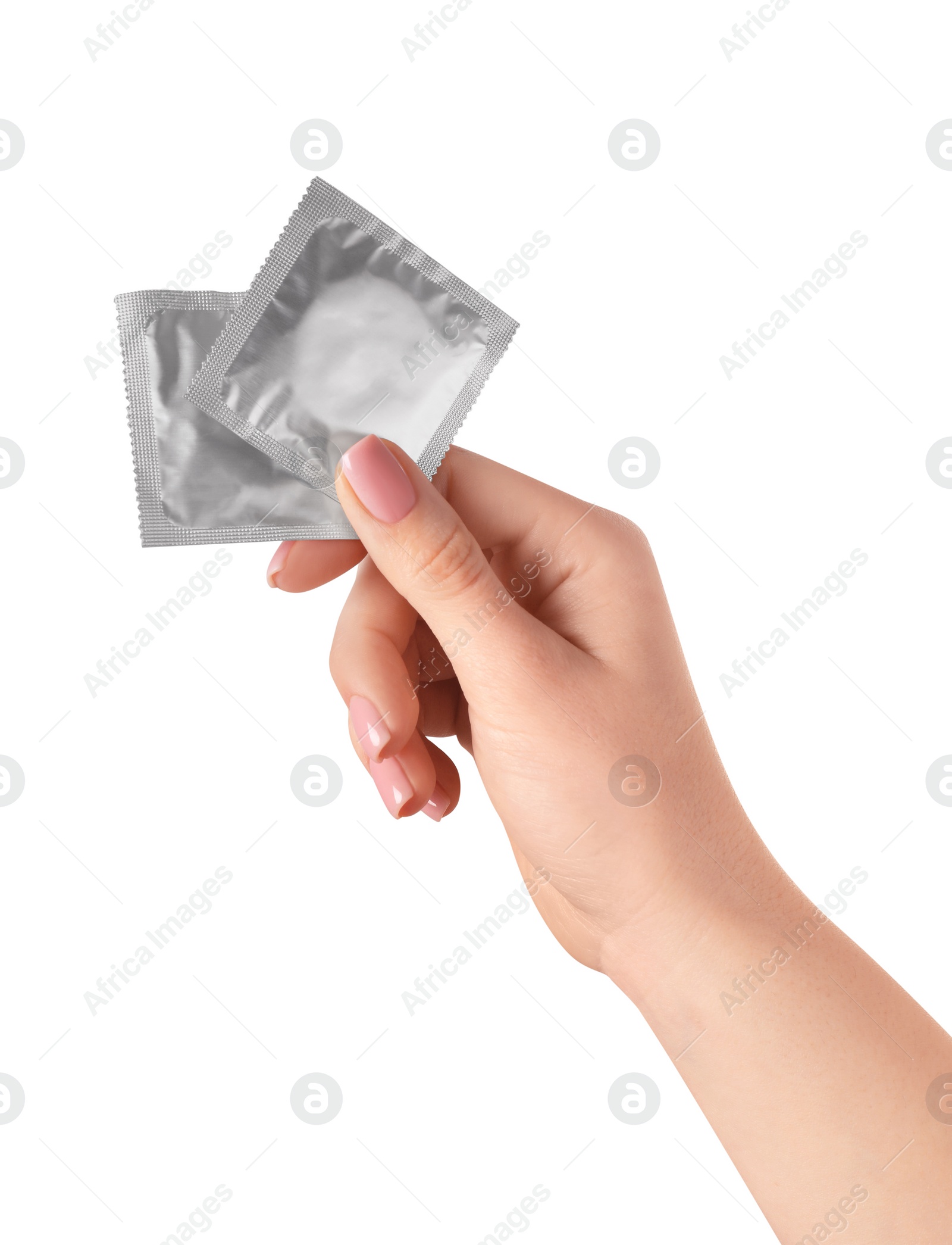 Photo of Woman holding condoms on white background, closeup