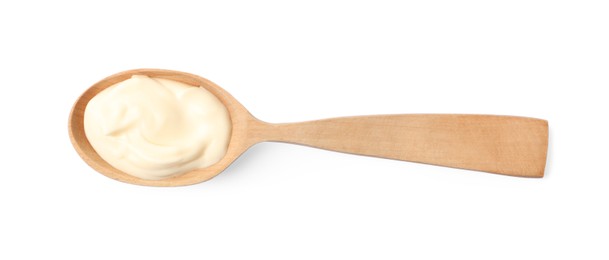 Photo of Mayonnaise in wooden spoon isolated on white, top view