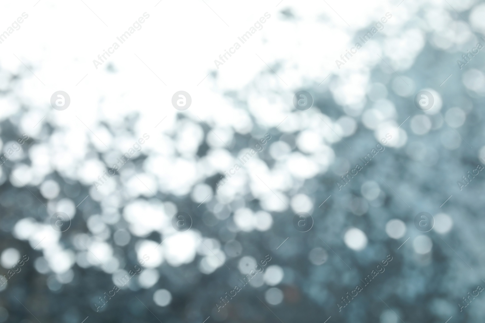 Photo of Blurred view of color glitter as background