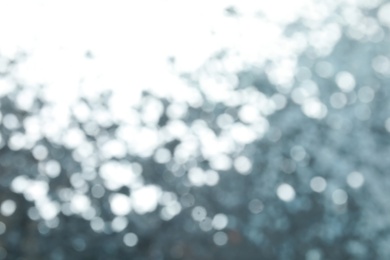 Photo of Blurred view of color glitter as background