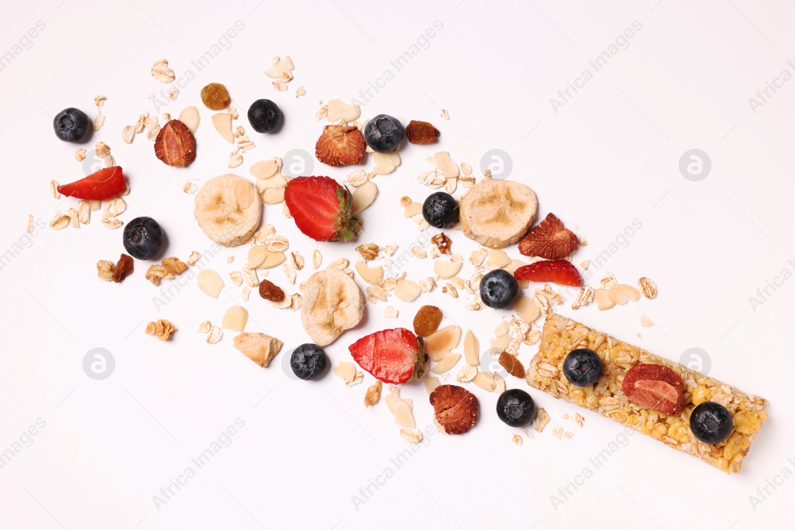 Photo of Tasty granola bar and ingredients isolated on white, top view