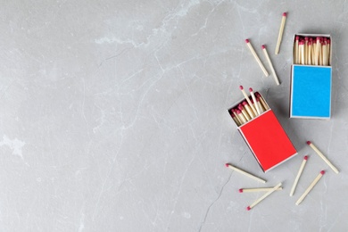 Photo of Flat lay composition with matches and space for text on light background