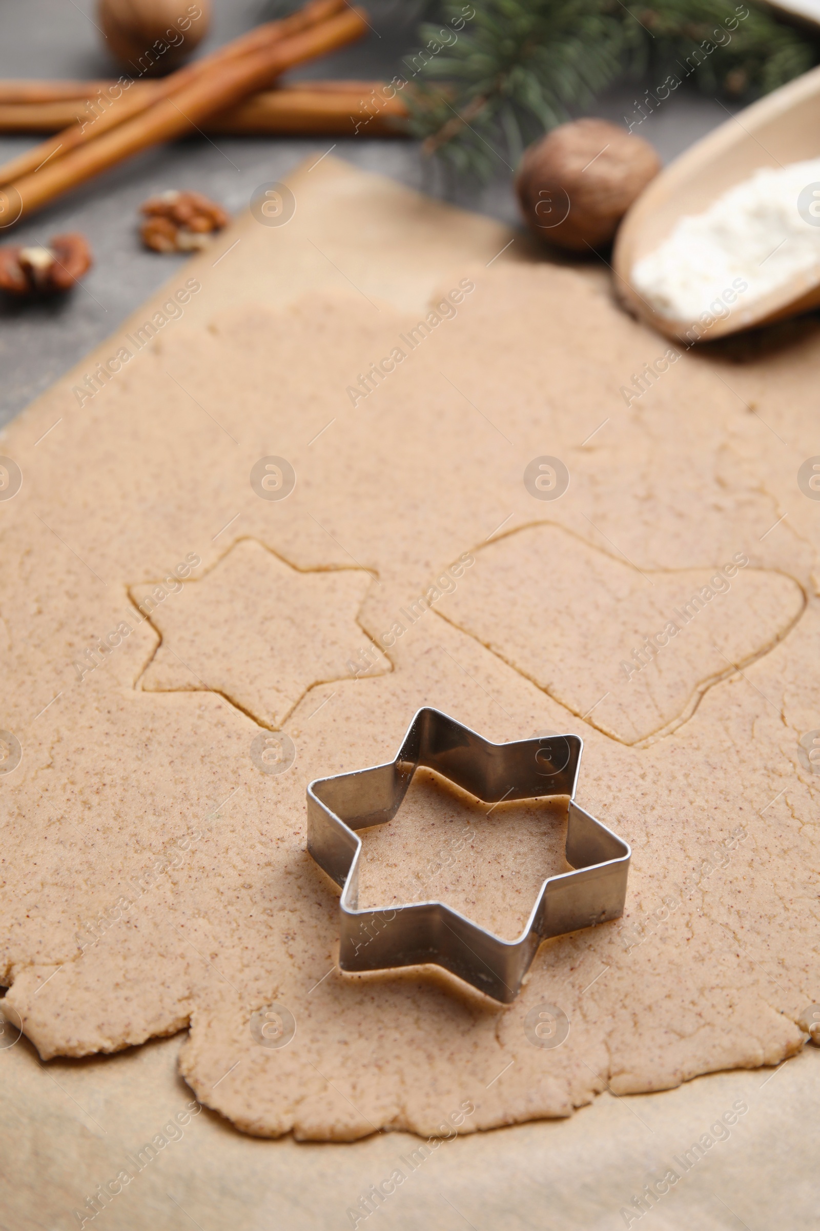 Photo of Homemade Christmas biscuits. Dough and cookie cutter on table, closeup