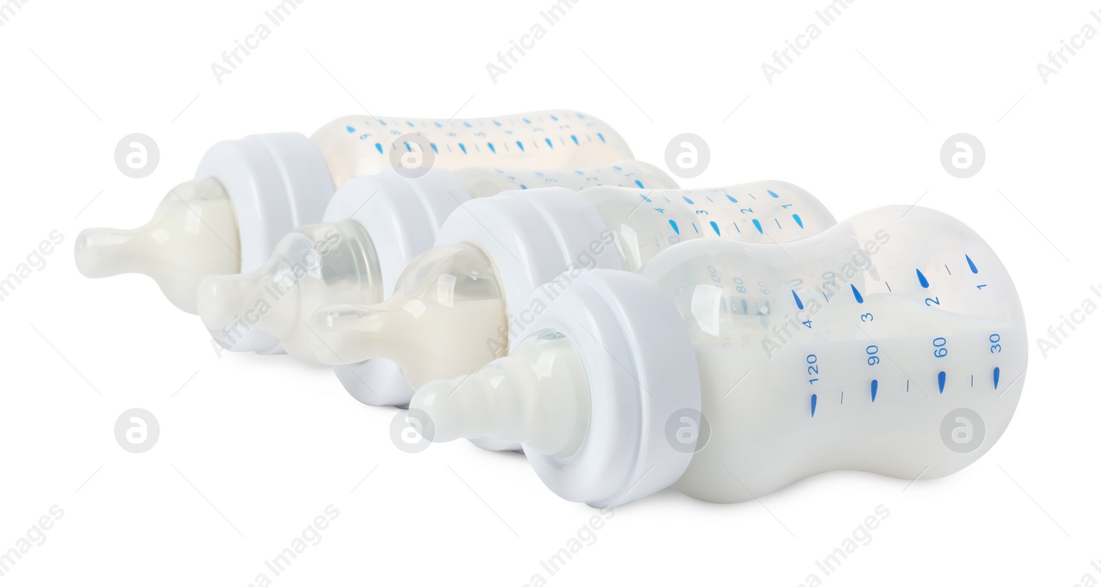 Photo of Feeding bottles with milk on white background