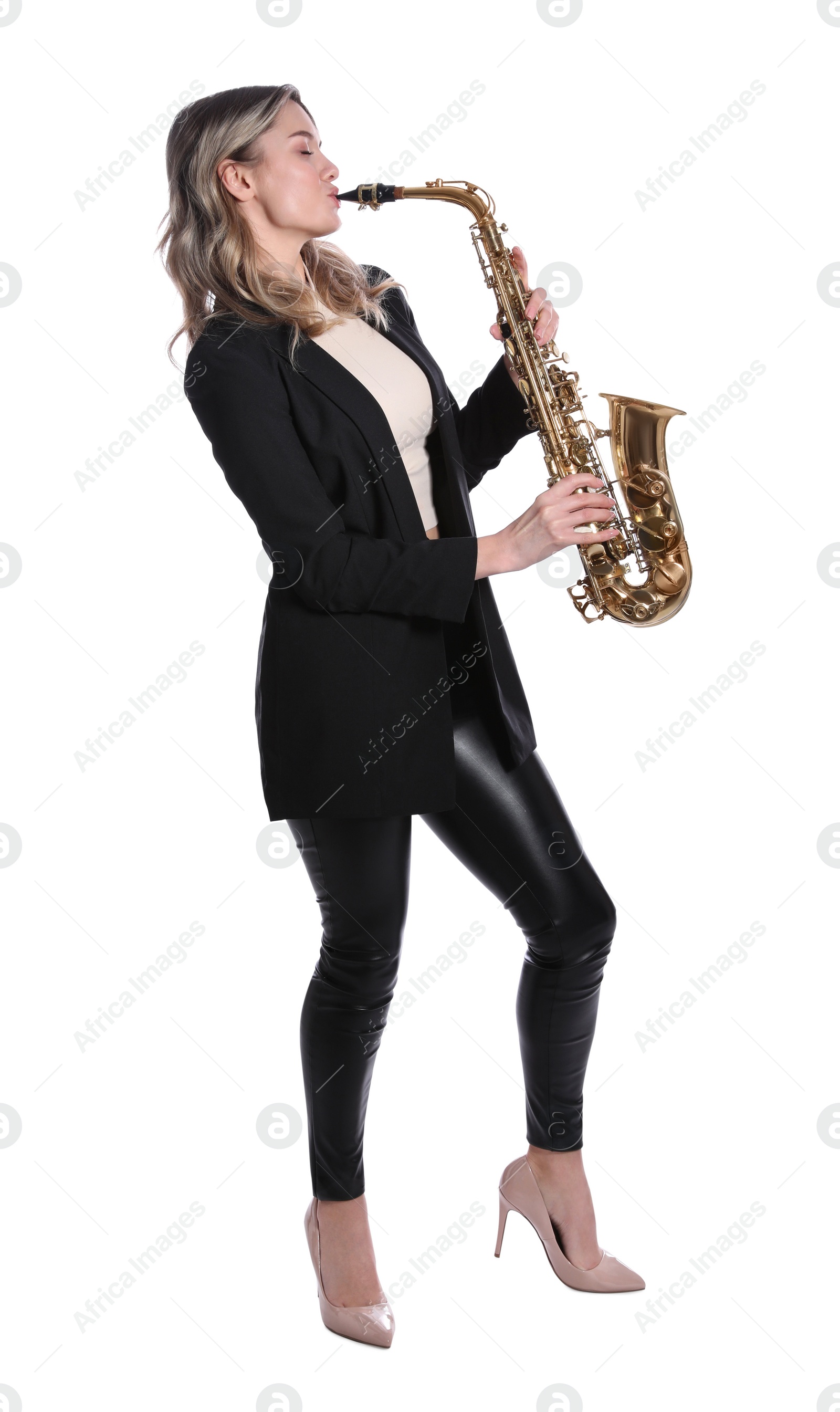 Photo of Beautiful young woman in elegant suit playing saxophone on white background