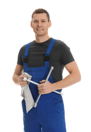 Portrait of professional auto mechanic with lug wrench and rag on white background
