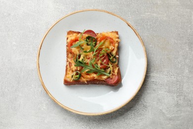 Photo of Tasty pizza toast on grey table, top view
