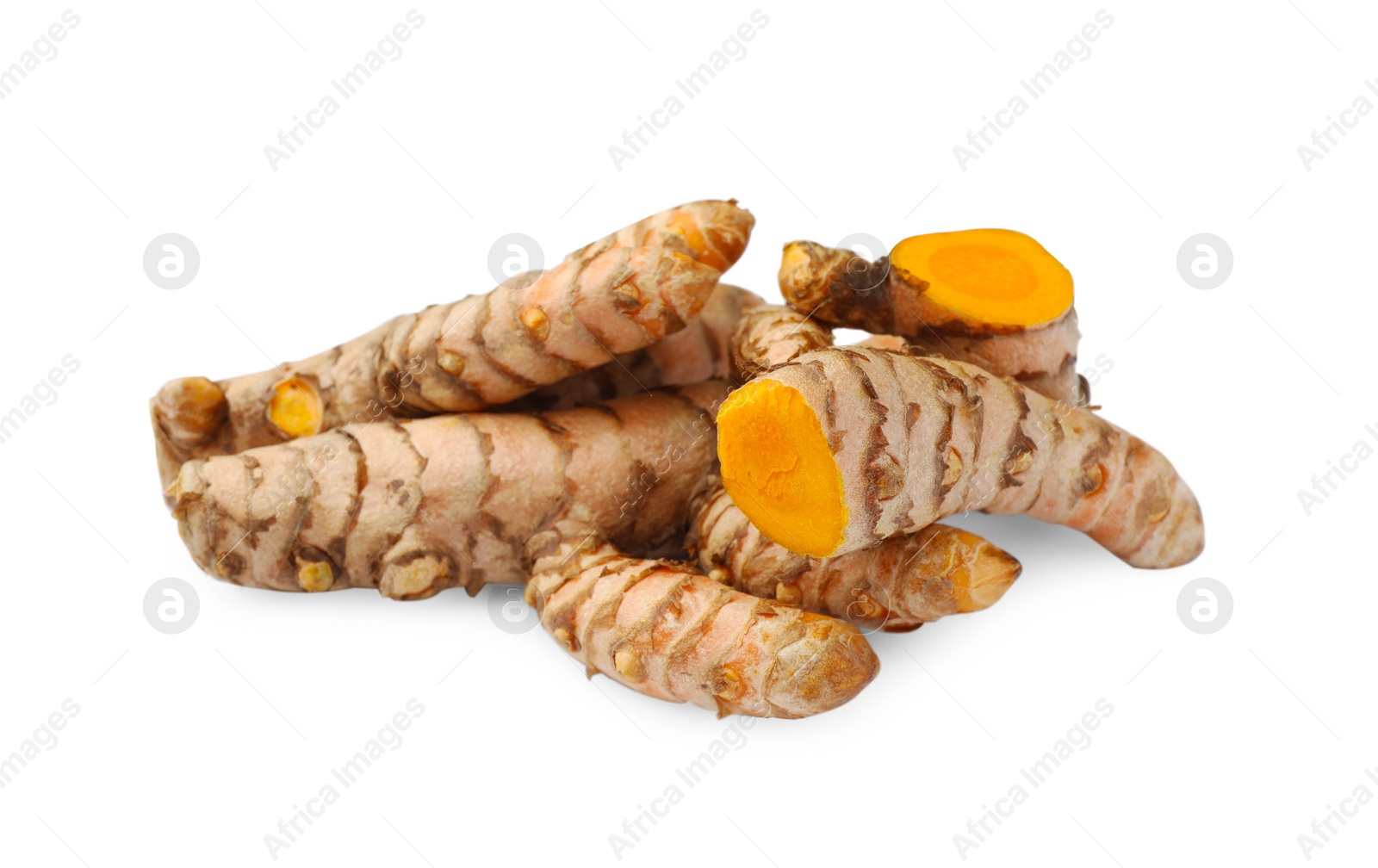 Photo of Whole and cut turmeric roots isolated on white