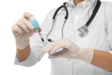 Photo of Doctor filling syringe with medication from glass vial on white background, closeup