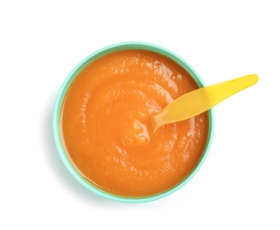 Bowl of healthy baby food on white background, top view