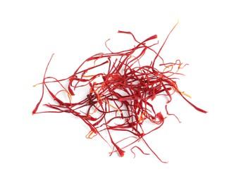 Photo of Heap of aromatic saffron on white background, top view
