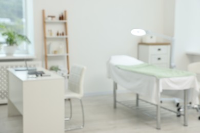 Modern interior of dermatologist's office with examination table