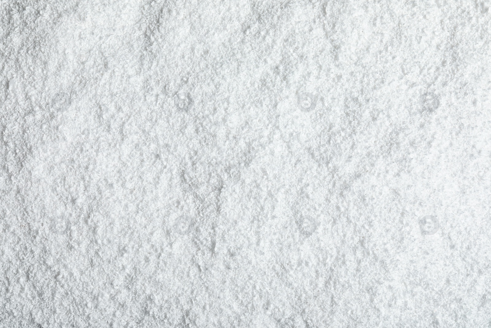 Photo of Pile of white snow as background, top view