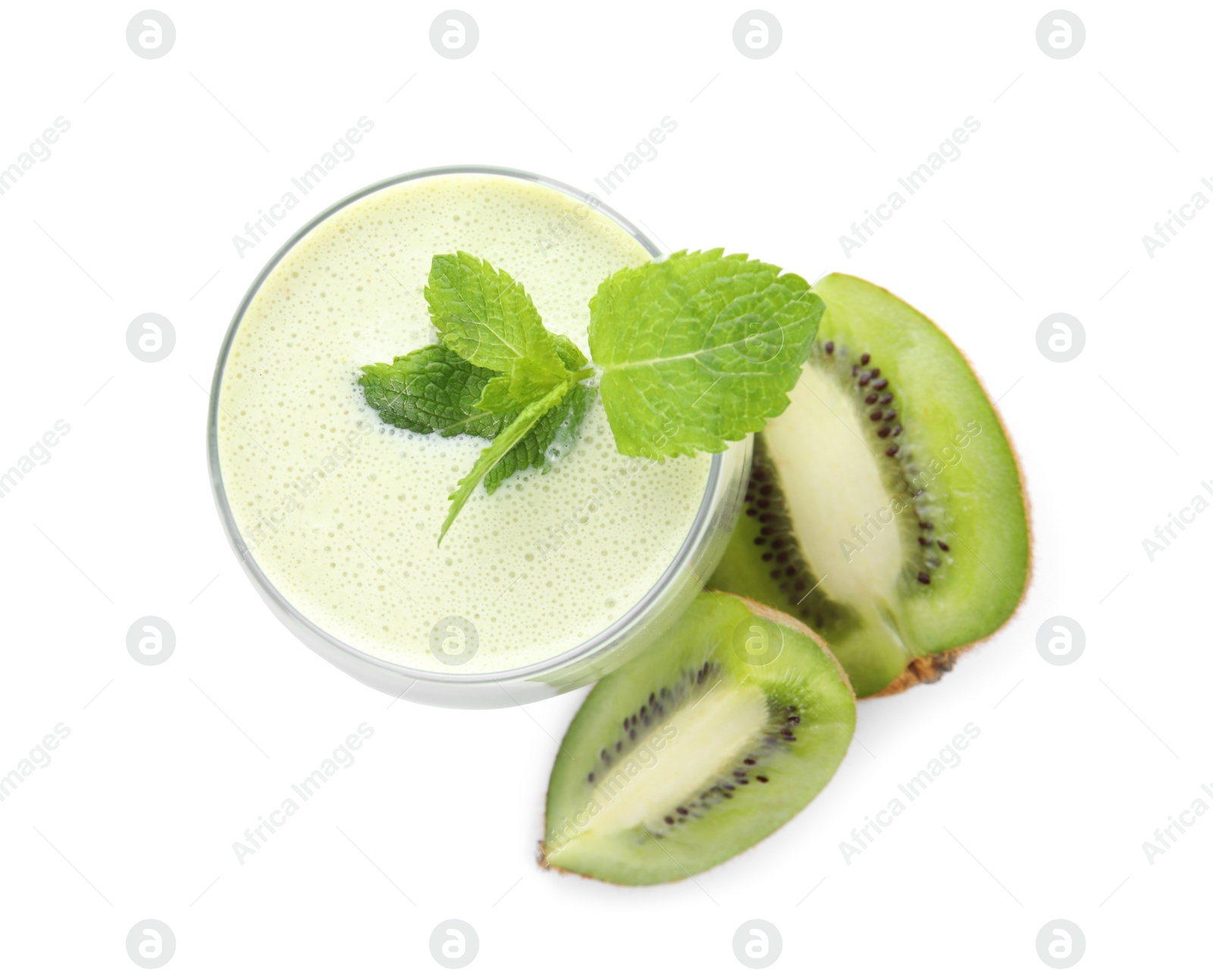 Photo of Tasty milk shake with mint and kiwi slices isolated on white, top view