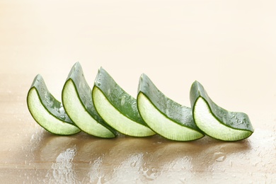 Fresh sliced aloe vera leaves on light table