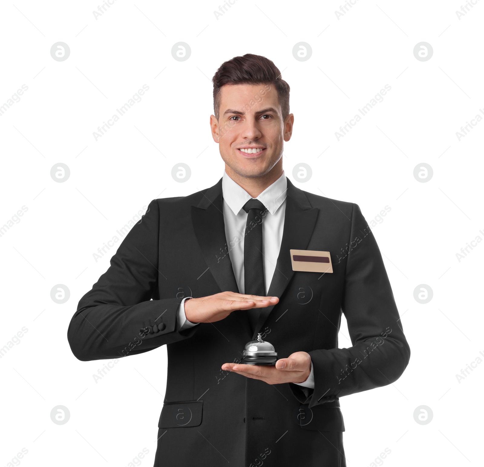 Photo of Happy receptionist in uniform holding service bell on white background