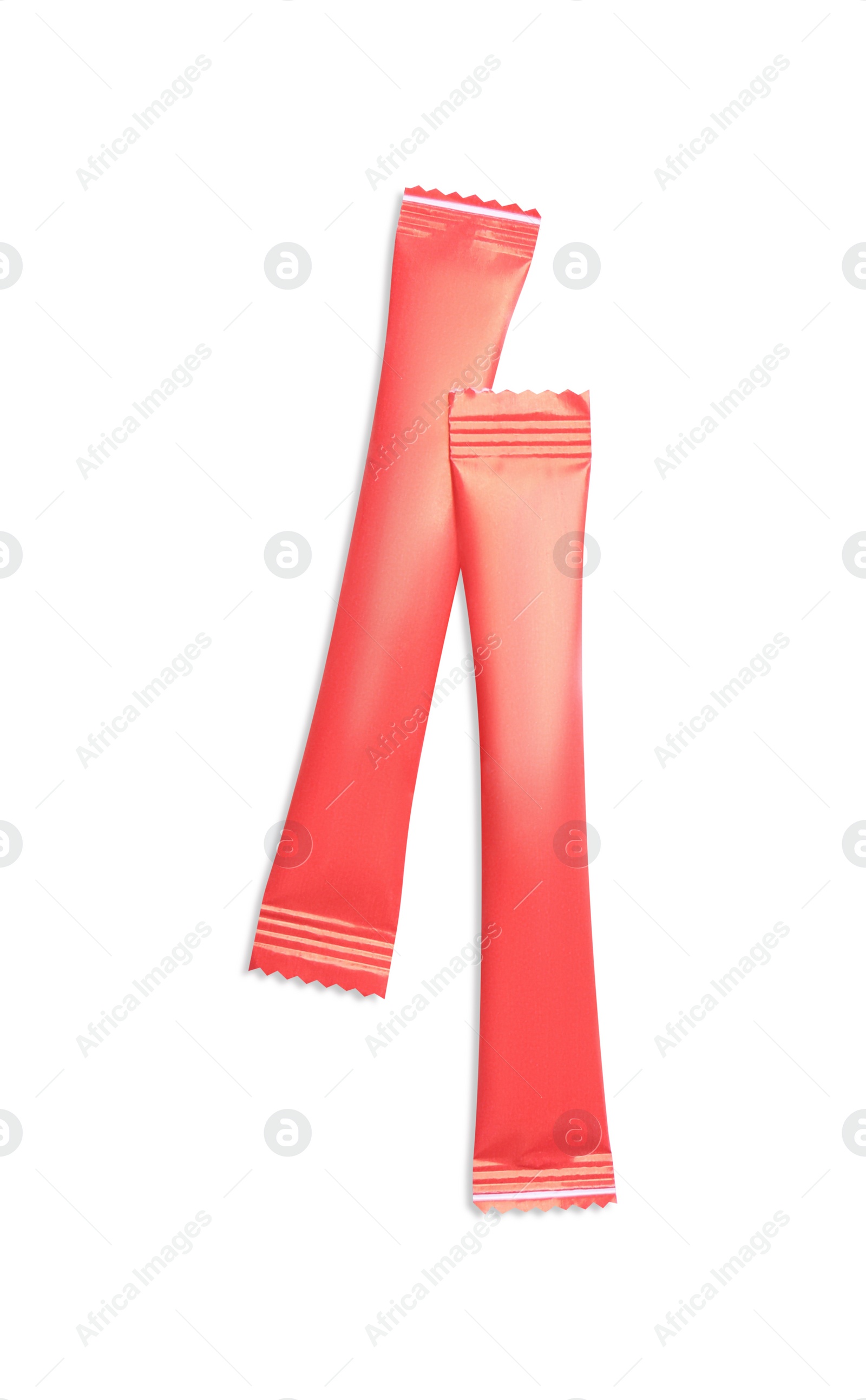 Photo of Red sticks of sugar on white background, top view