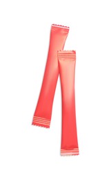 Photo of Red sticks of sugar on white background, top view