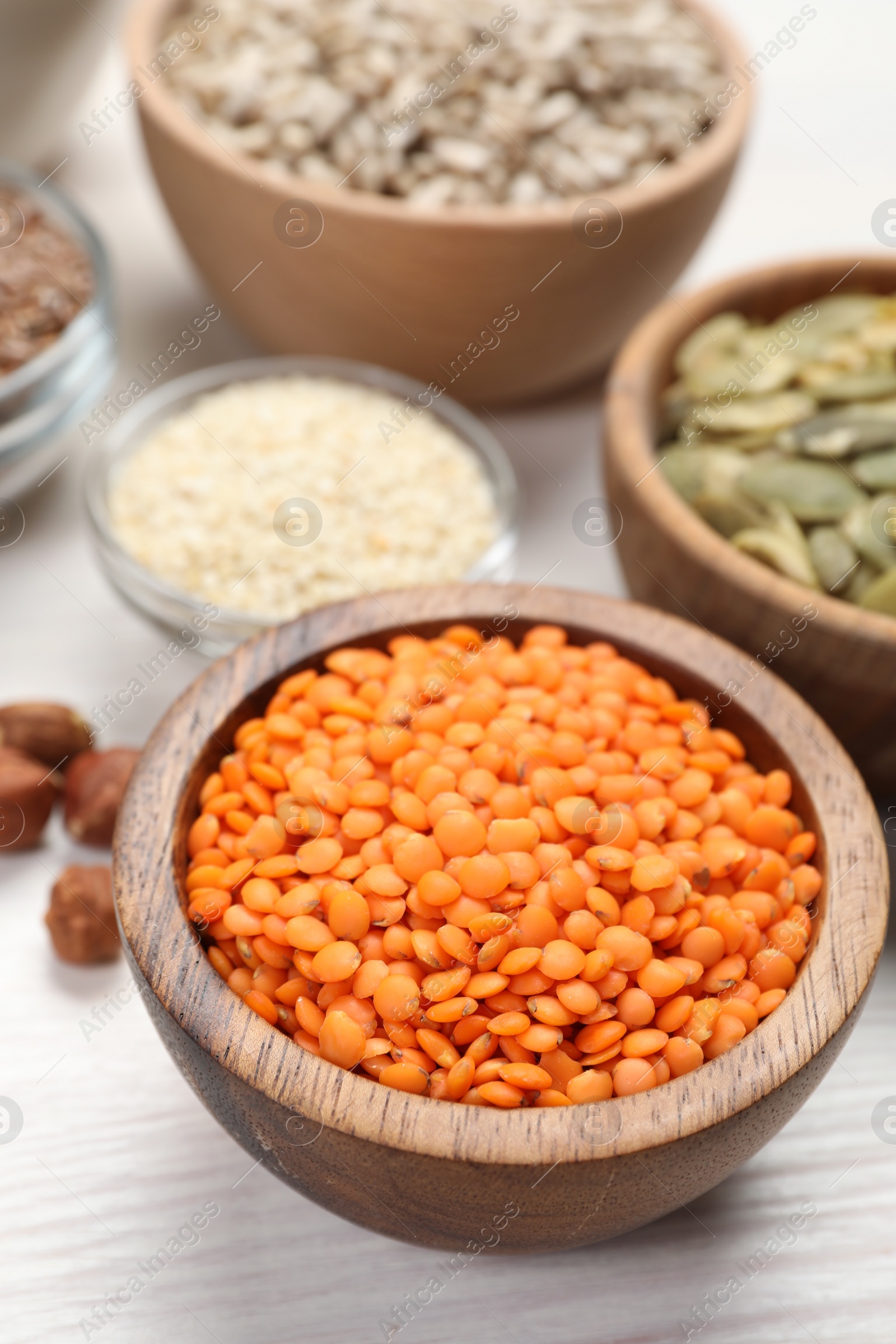 Photo of Different products high in vegetable fats on white wooden table, closeup