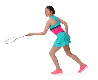 Young woman playing badminton with racket on white background