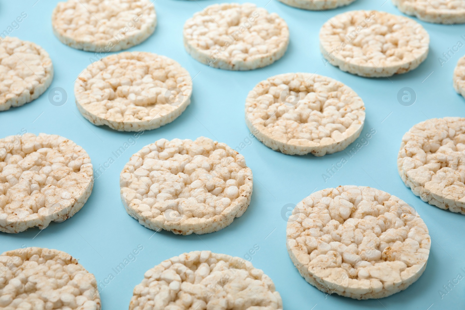 Photo of Puffed rice cakes on light blue background