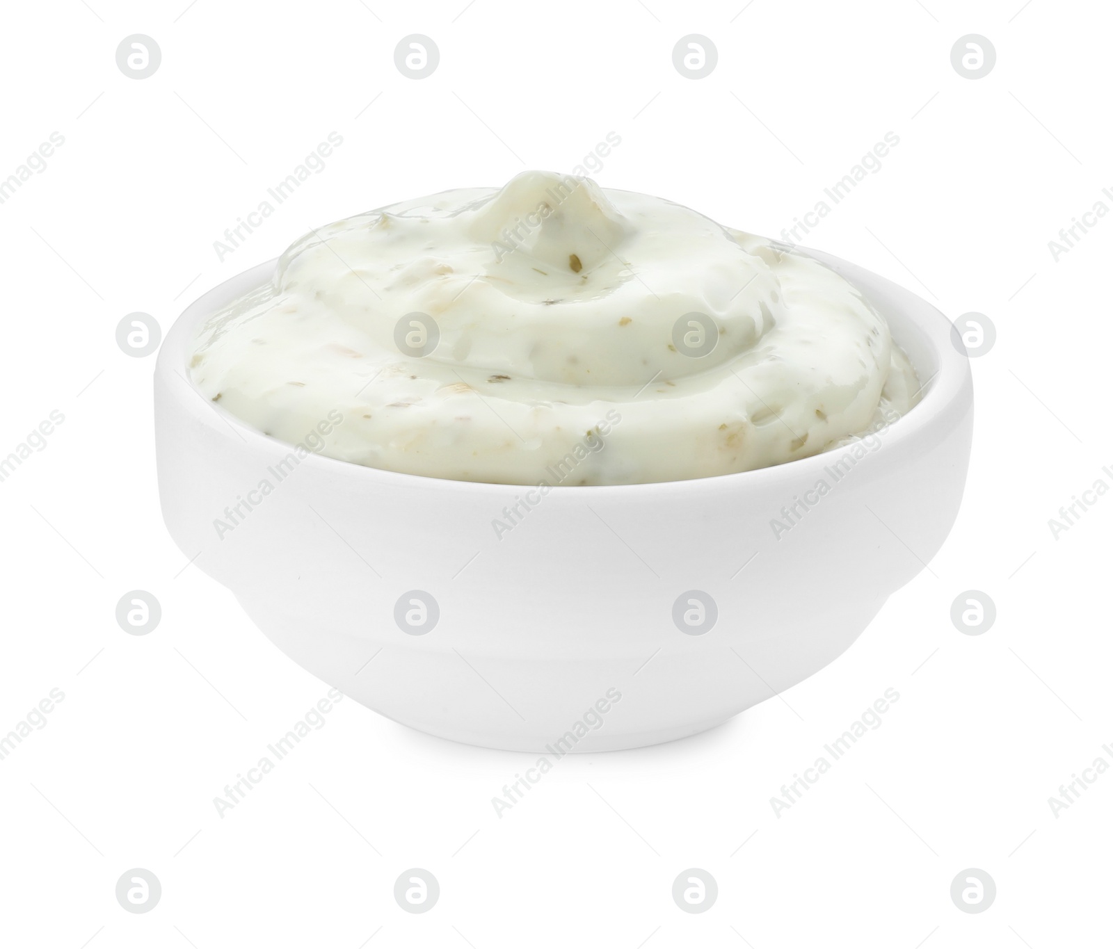 Photo of Tasty tartar sauce in bowl isolated on white