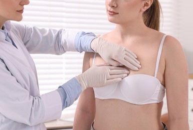 Photo of Mammologist checking young woman's breast in hospital