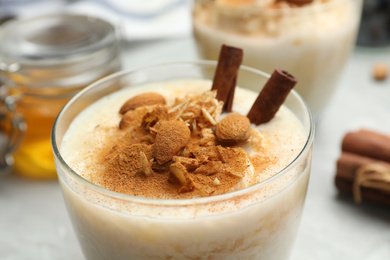 Photo of Delicious rice pudding with almonds and cinnamon, closeup