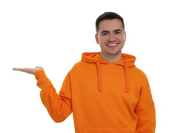 Special promotion. Happy man showing something on white background