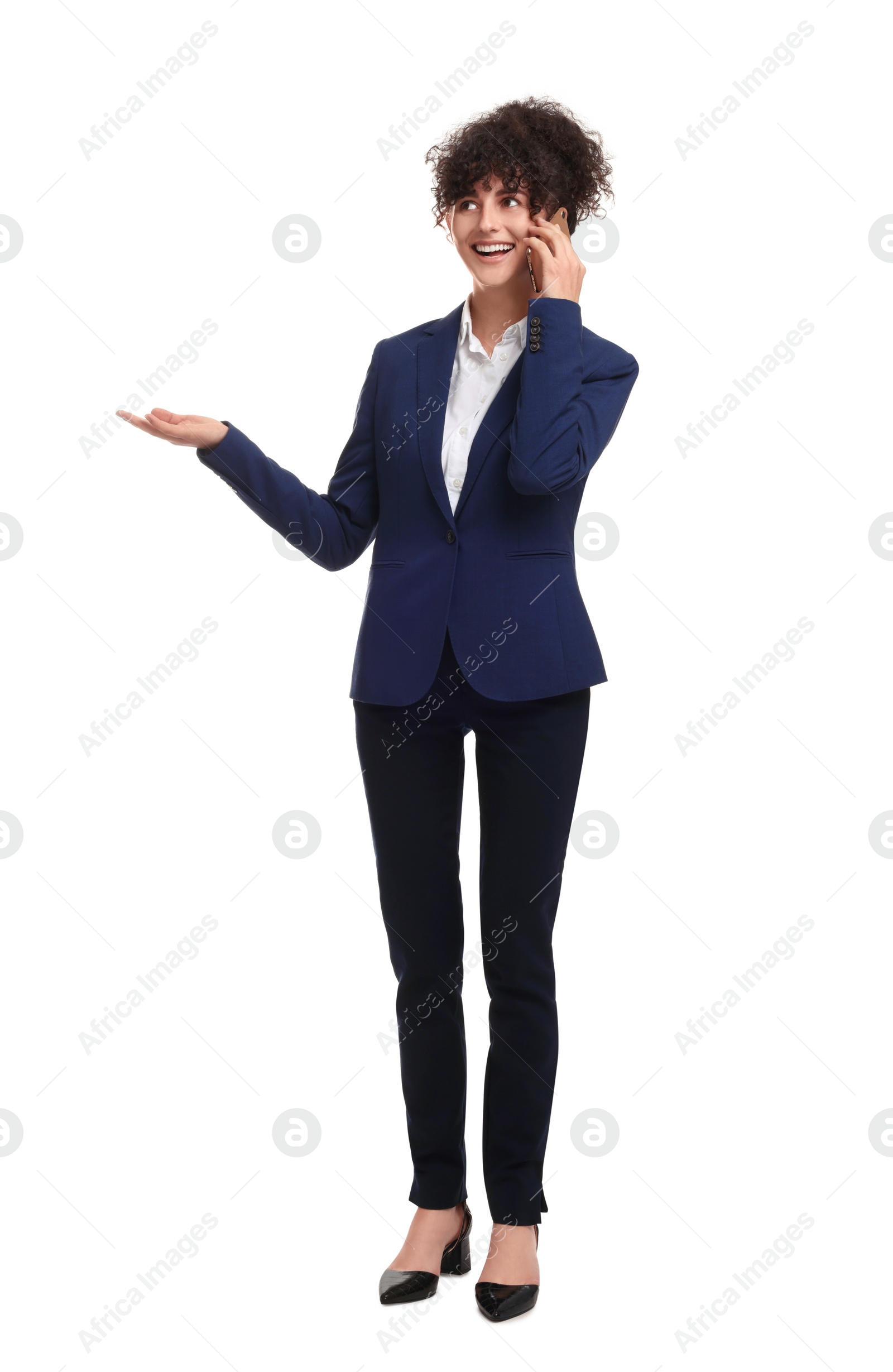 Photo of Beautiful businesswoman in suit talking on smartphone against white background