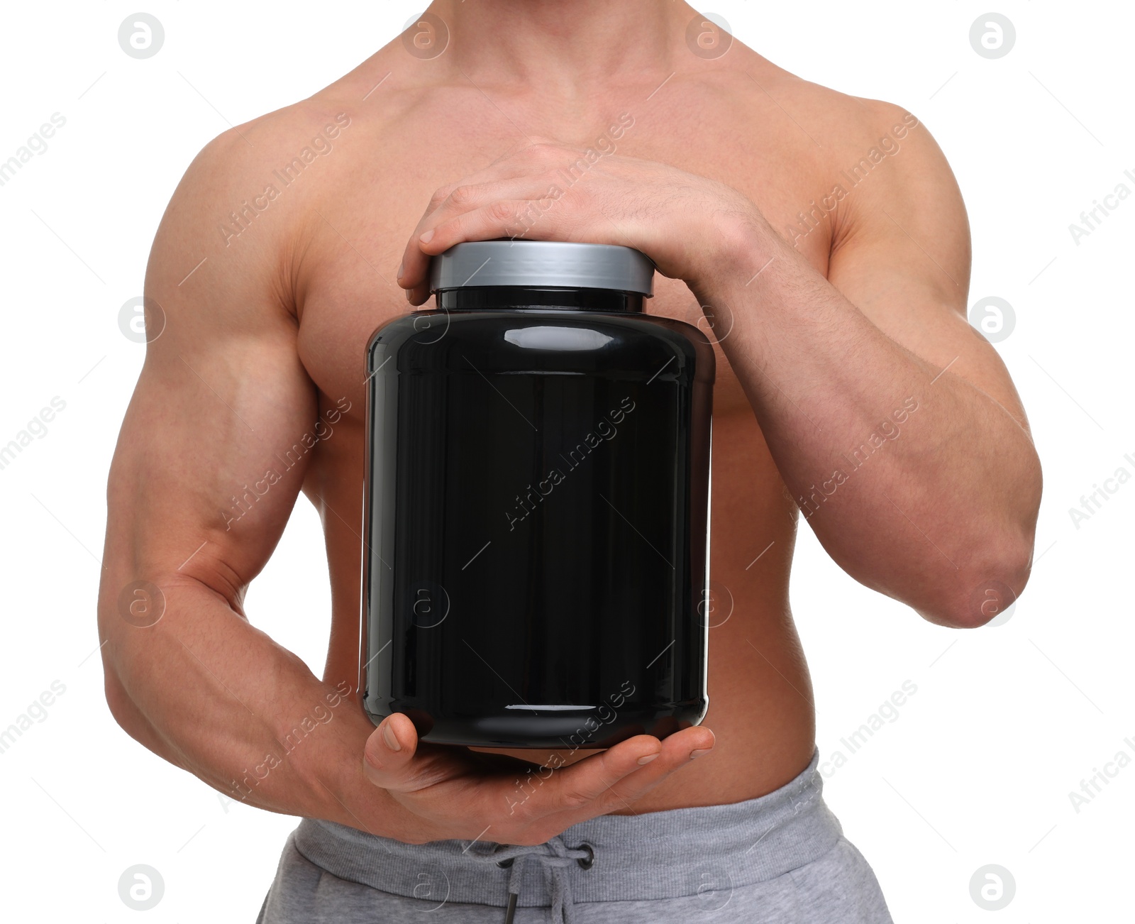 Photo of Young man with muscular body holding jar of protein powder on white background, closeup