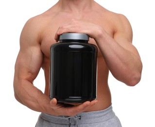 Young man with muscular body holding jar of protein powder on white background, closeup