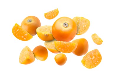 Ripe orange physalis fruits falling on white background