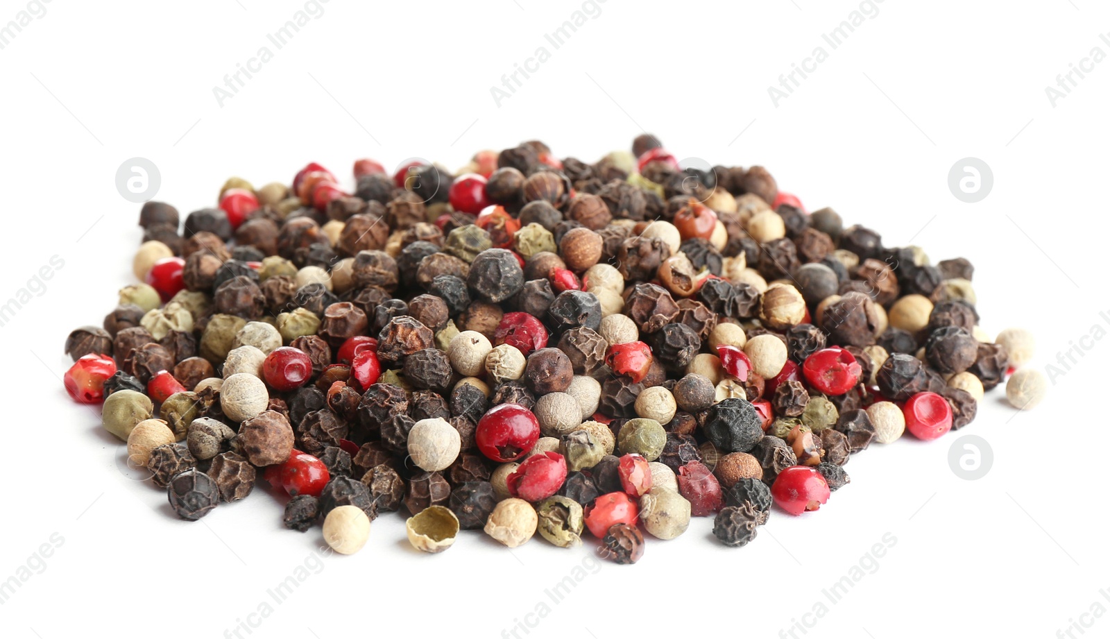 Photo of Heap of mixed peppercorns isolated on white