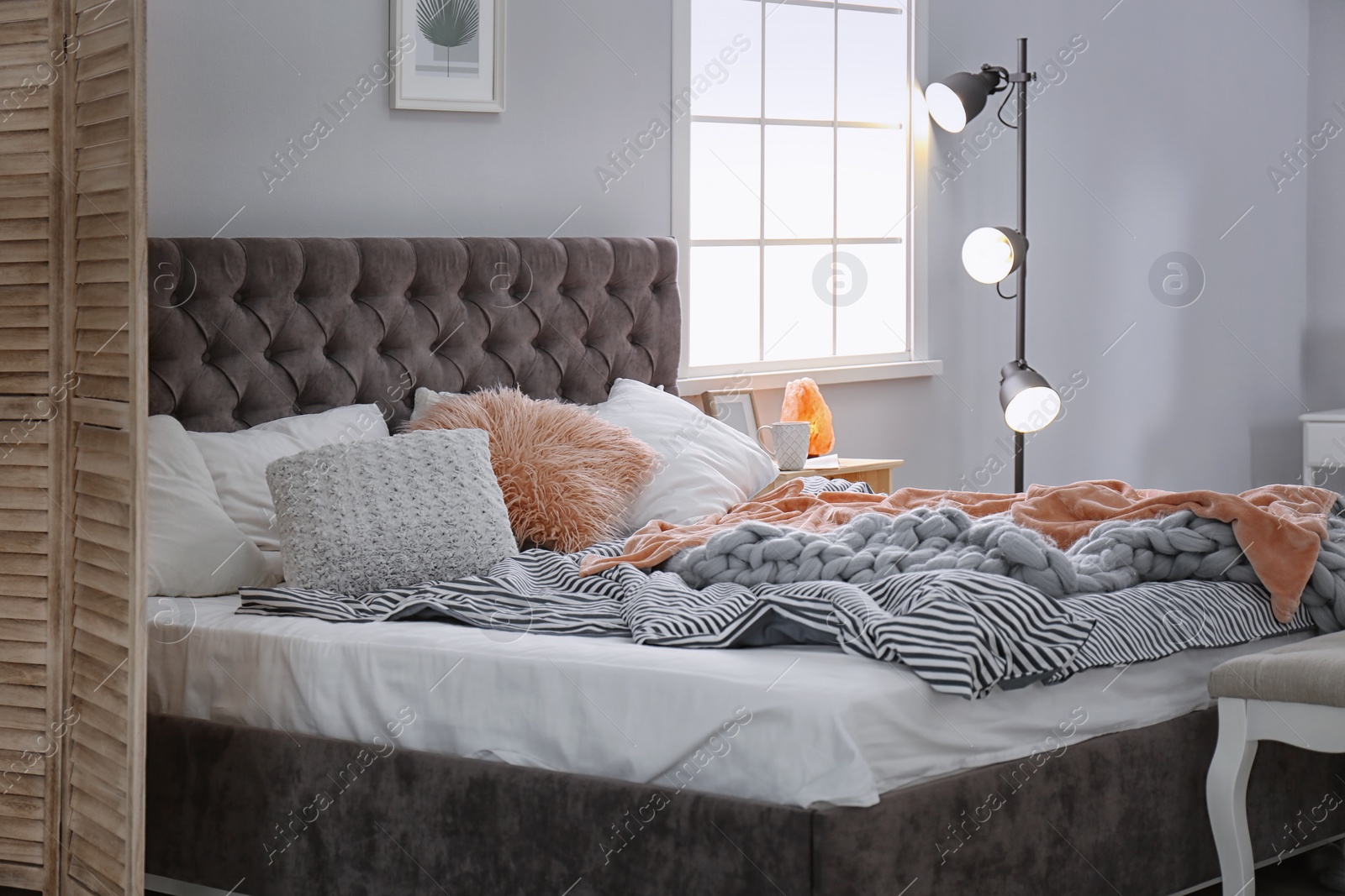 Photo of Stylish bedroom interior with comfortable bed