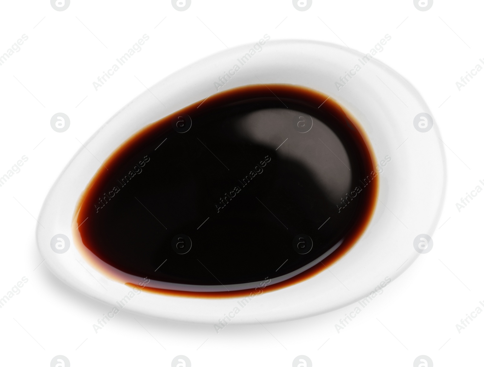 Photo of Bowl of soy sauce isolated on white, top view