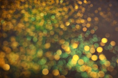 Photo of Blurred view of shiny glitter as background. Bokeh effect