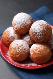 Photo of Delicious sweet buns on dark gray table
