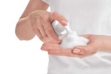 Photo of Woman applying cleansing foam onto hand on white background, closeup