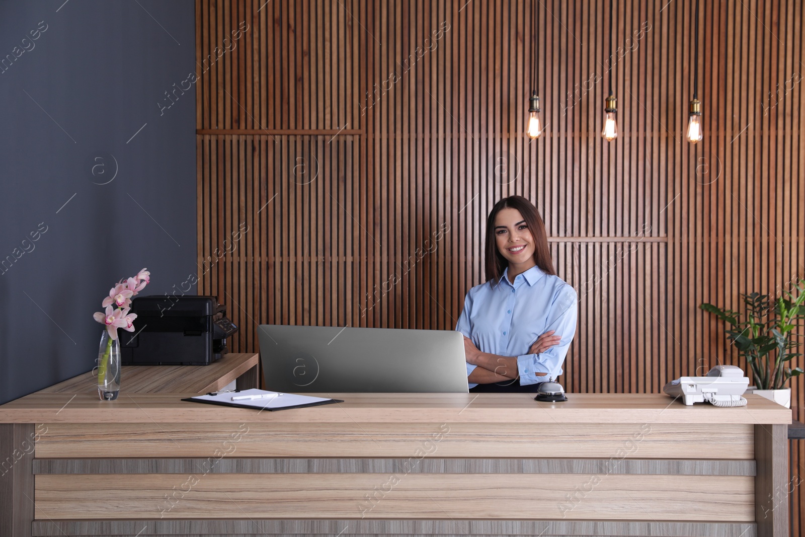 Photo of Portrait of receptionist at desk in lobby